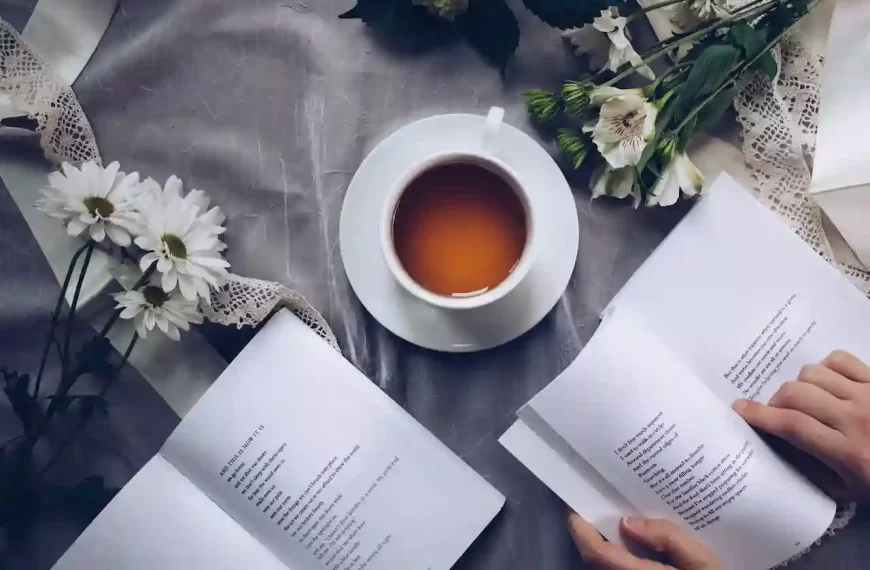 2 books on a table with a cup of tea