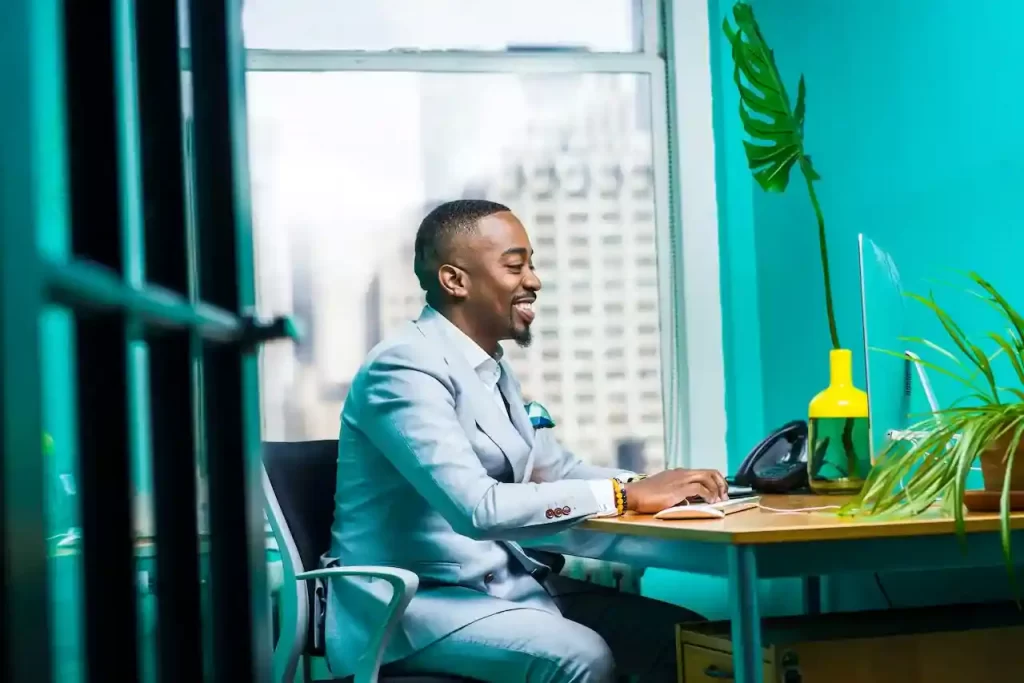 Man Sitting In front of a computer