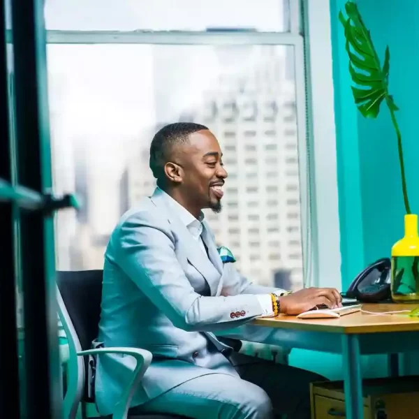 Man Sitting In front of a computer