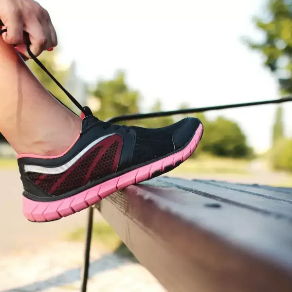 Close up of someone tying a shoe lace