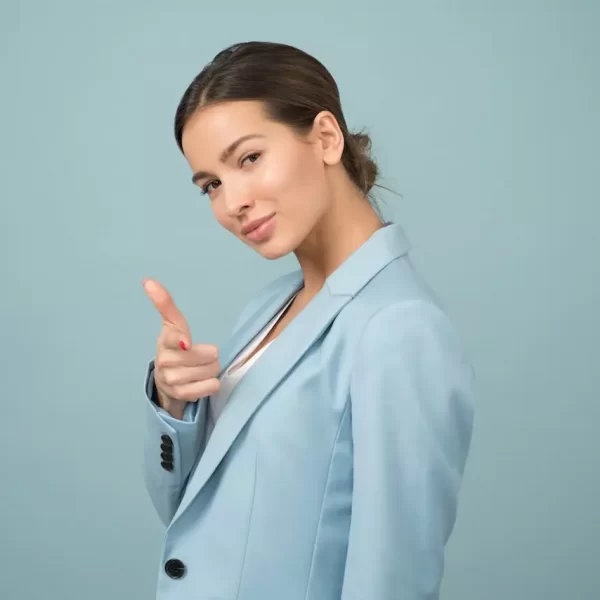 A woman pointing a finger at you with a smile on her face