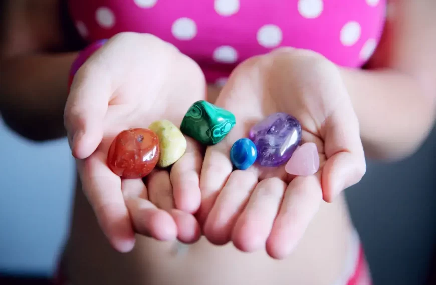 A girl with different colored polished stones