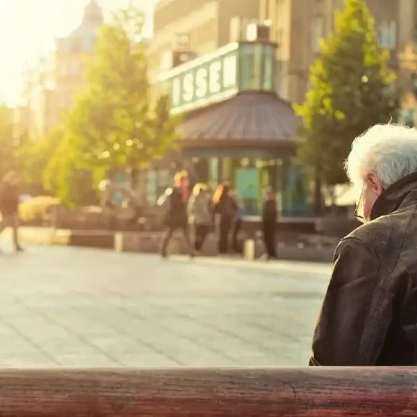 An old man relaxing on a bench