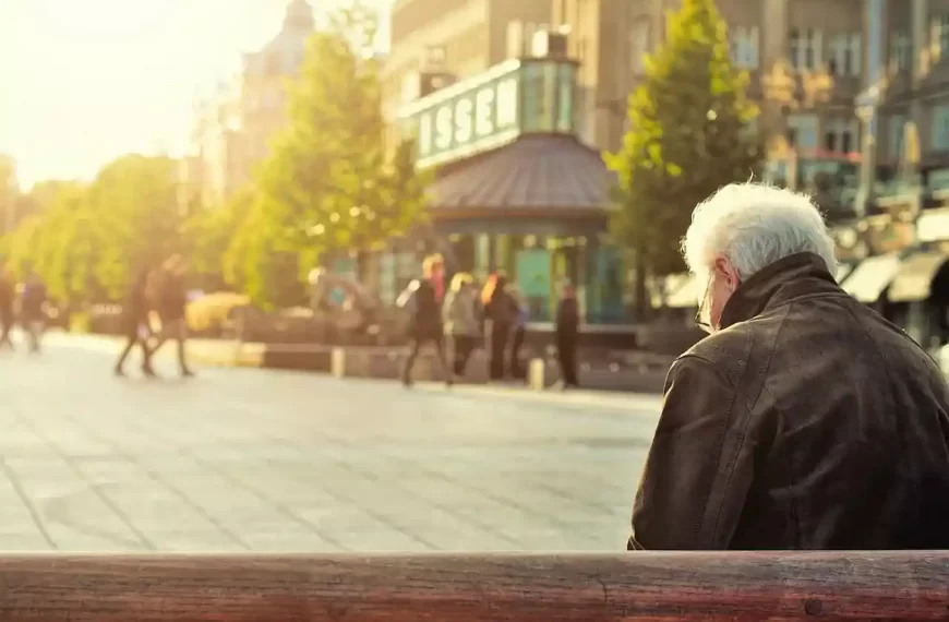 An old man relaxing on a bench