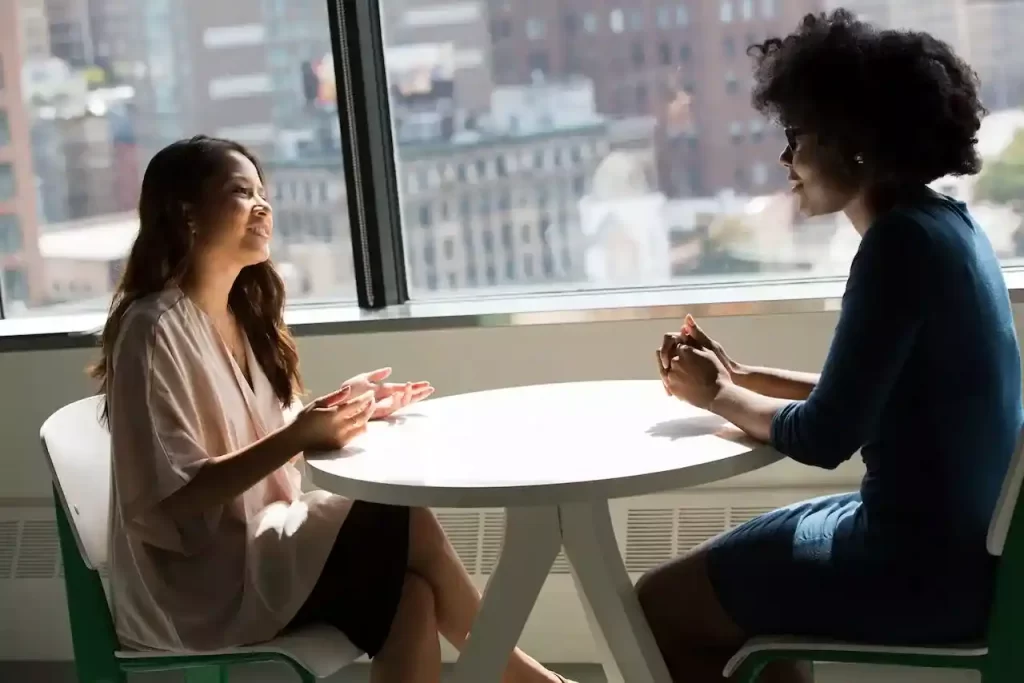 2 women talking to each other