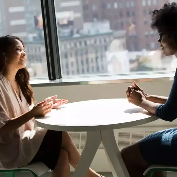 2 women talking to each other