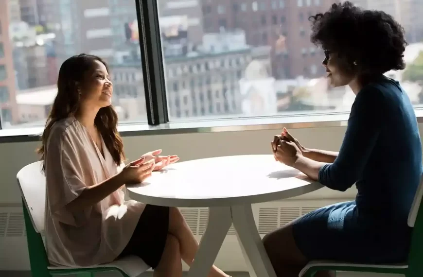 2 women talking to each other