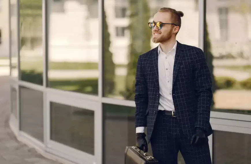 A cool guy in a black suit with sunglasses and a briefcase