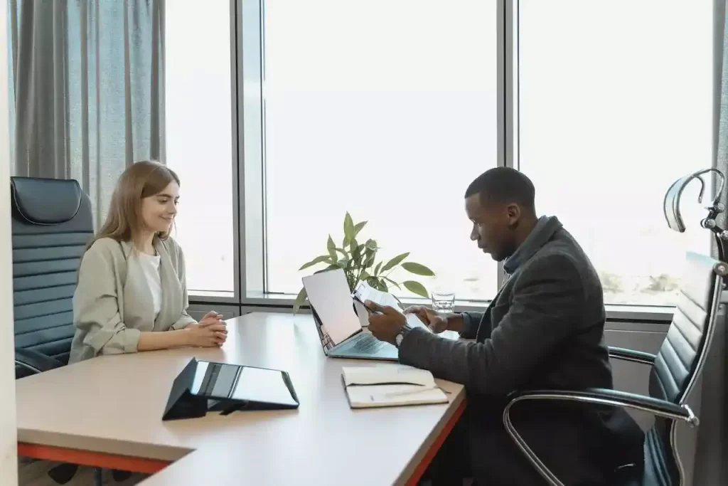 A man interviewing a woman