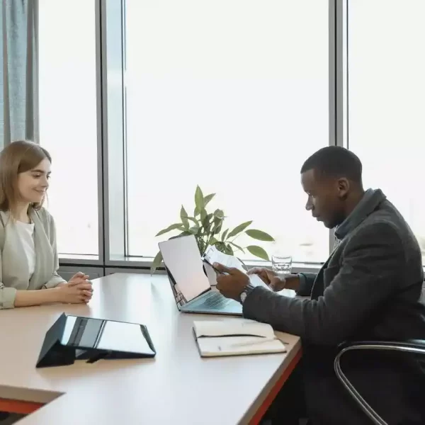 A man interviewing a woman