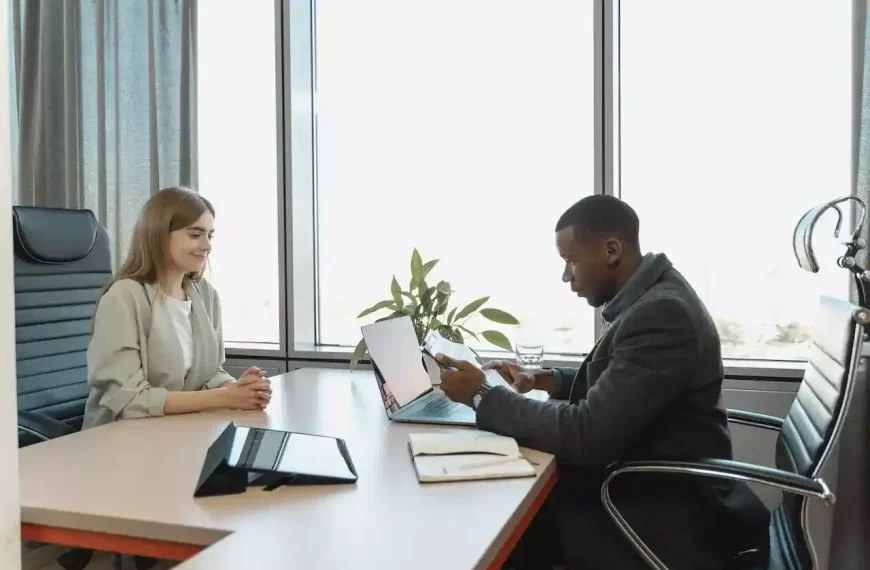 A man interviewing a woman