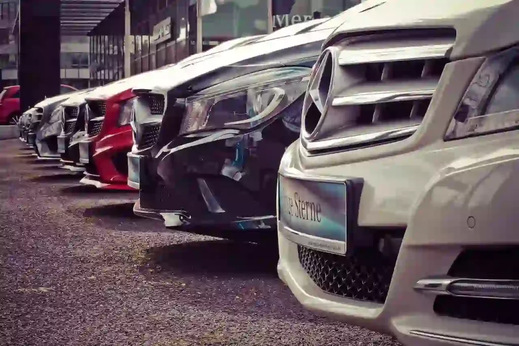 A bunch of Mercedes parked in a row