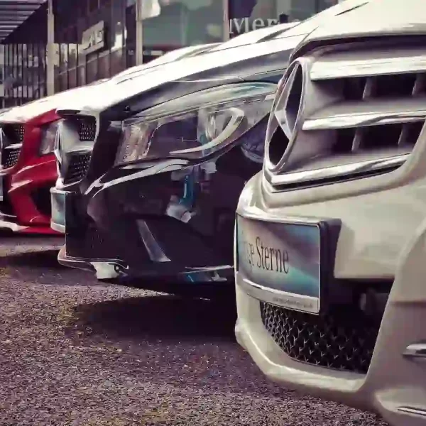 A bunch of Mercedes parked in a row