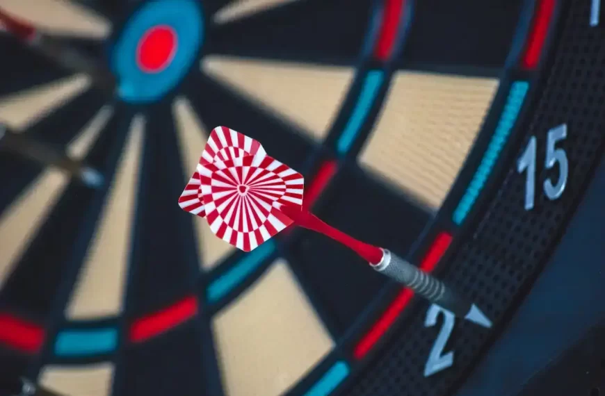 Red and white dart on a darts board