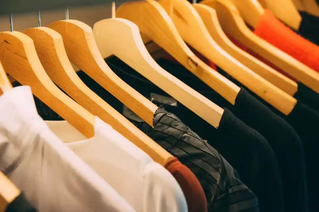 assorted clothes hanging from a hanger