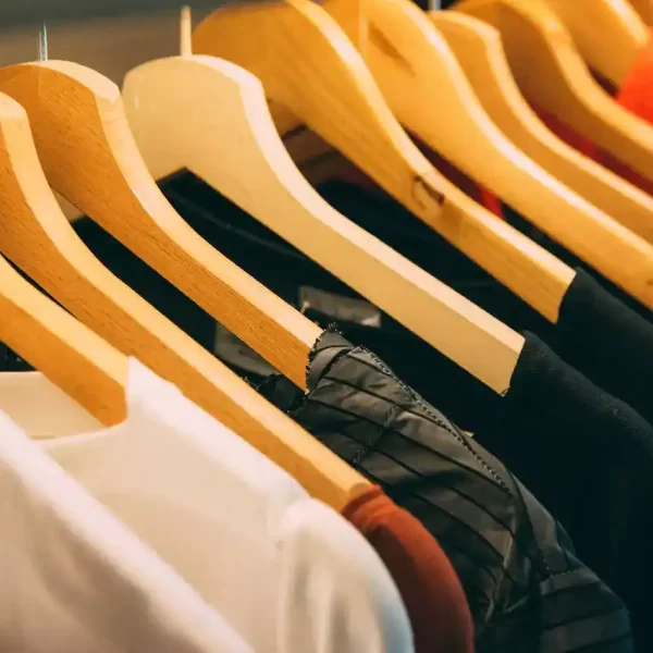 assorted clothes hanging from a hanger