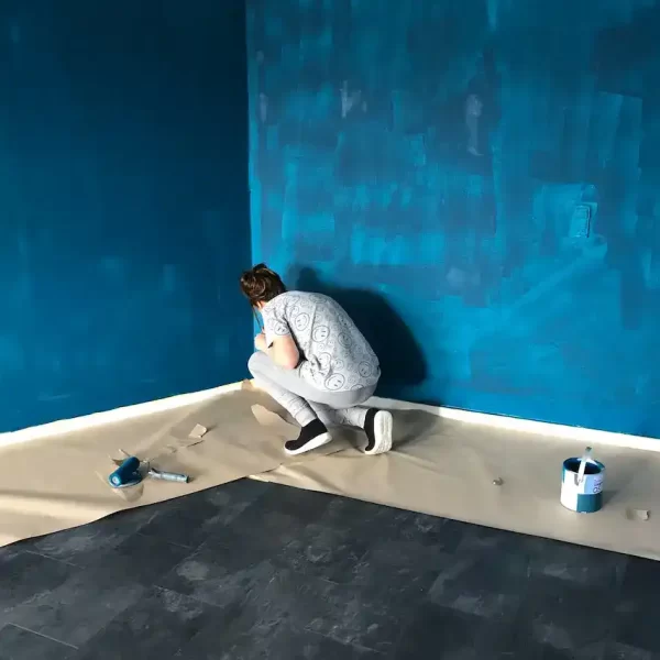 A woman painting the walls