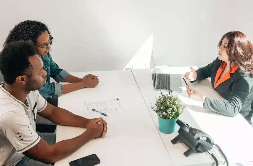 A couple sitting in front of a financial advisor