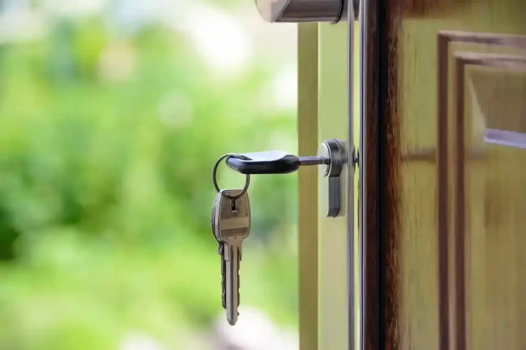 A key on a keyhole of a house door