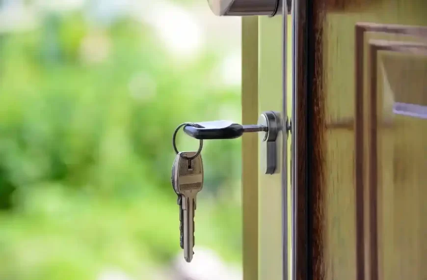 A key on a keyhole of a house door