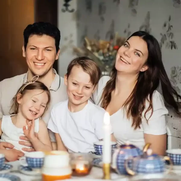 A family of four sitting at a table together