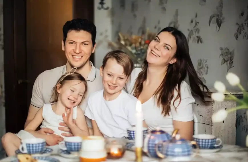 A family of four sitting at a table together