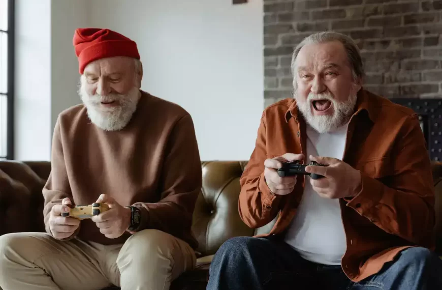 Two older gentlemen playing video games together