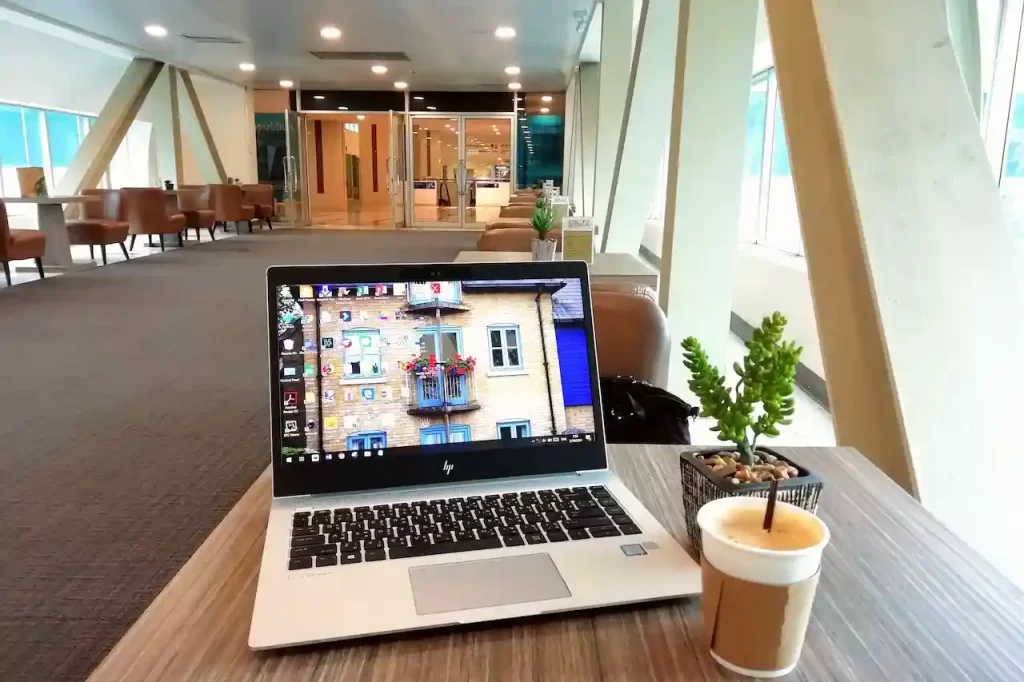 A laptop on a table in cafe