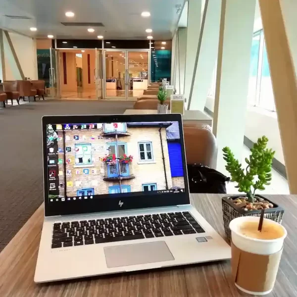 A laptop on a table in cafe