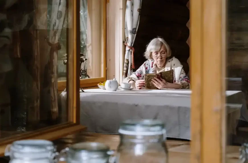 Elderly woman reading on a table