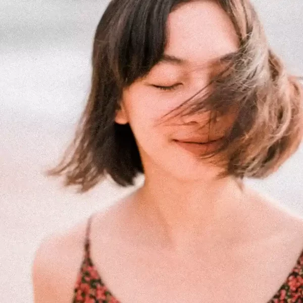 calm ethnic woman waving with short hair