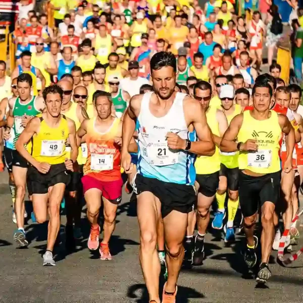 A large group of people running in a marathon